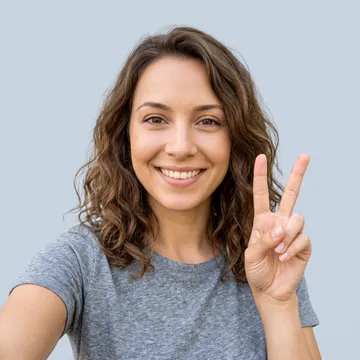 Example screening selfie: a person showing a peace sign